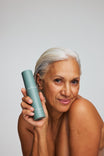 Alpha-H Retinol Reboot Exfoliating Body Treatment model met flacon